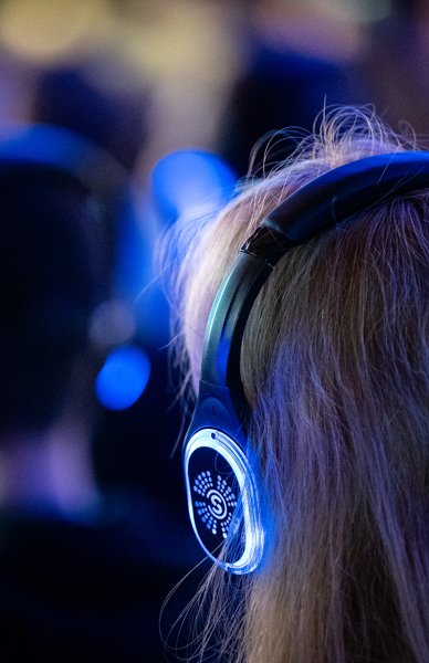 Person wearing headphones and listening to talk.jpg